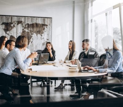 Group of people working out business plan in an office